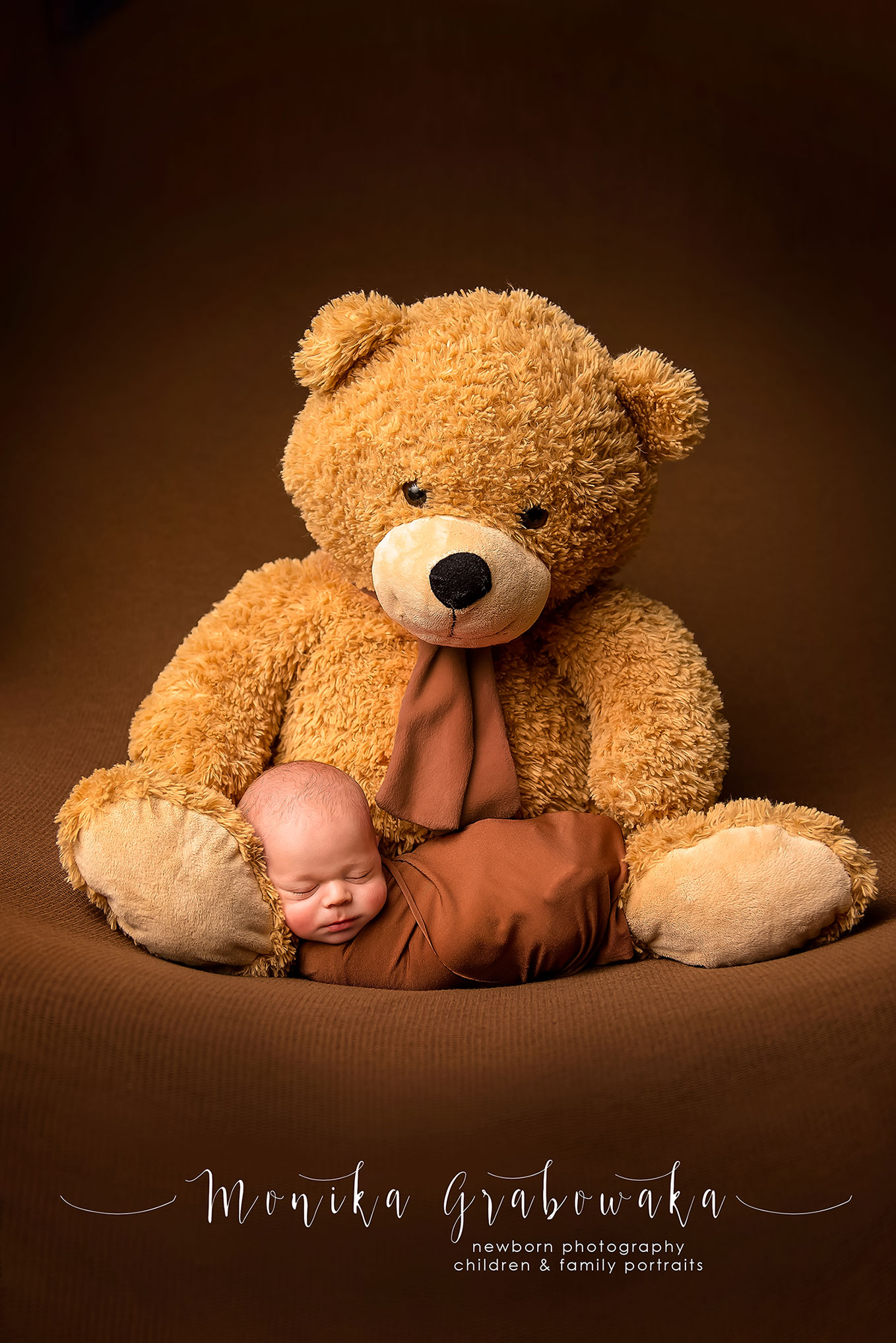 Newborn baby and teddy bear