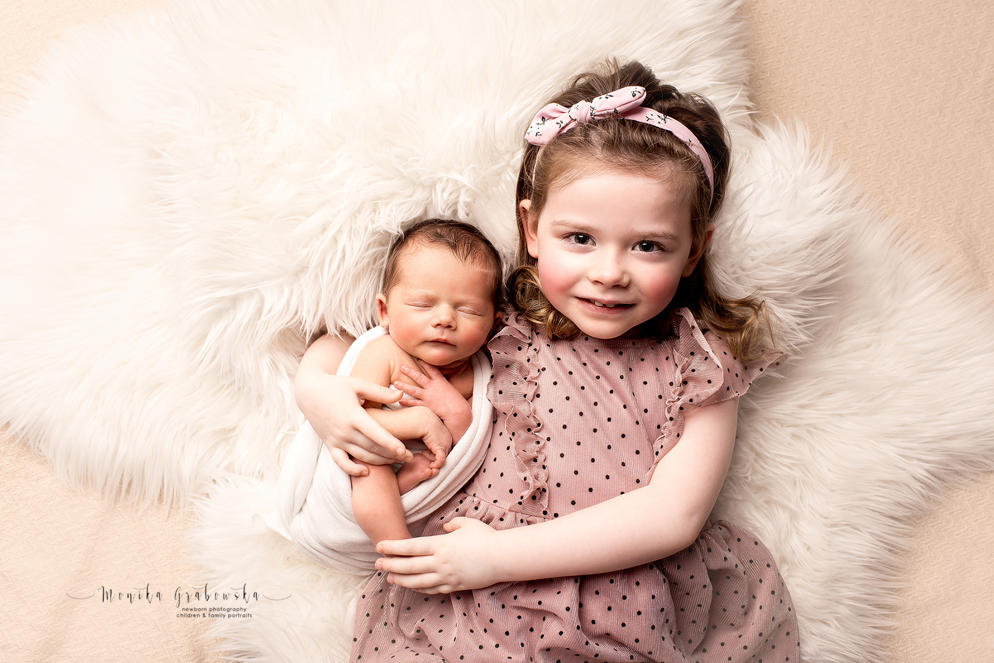 Portrait of siblings, newborn baby sister